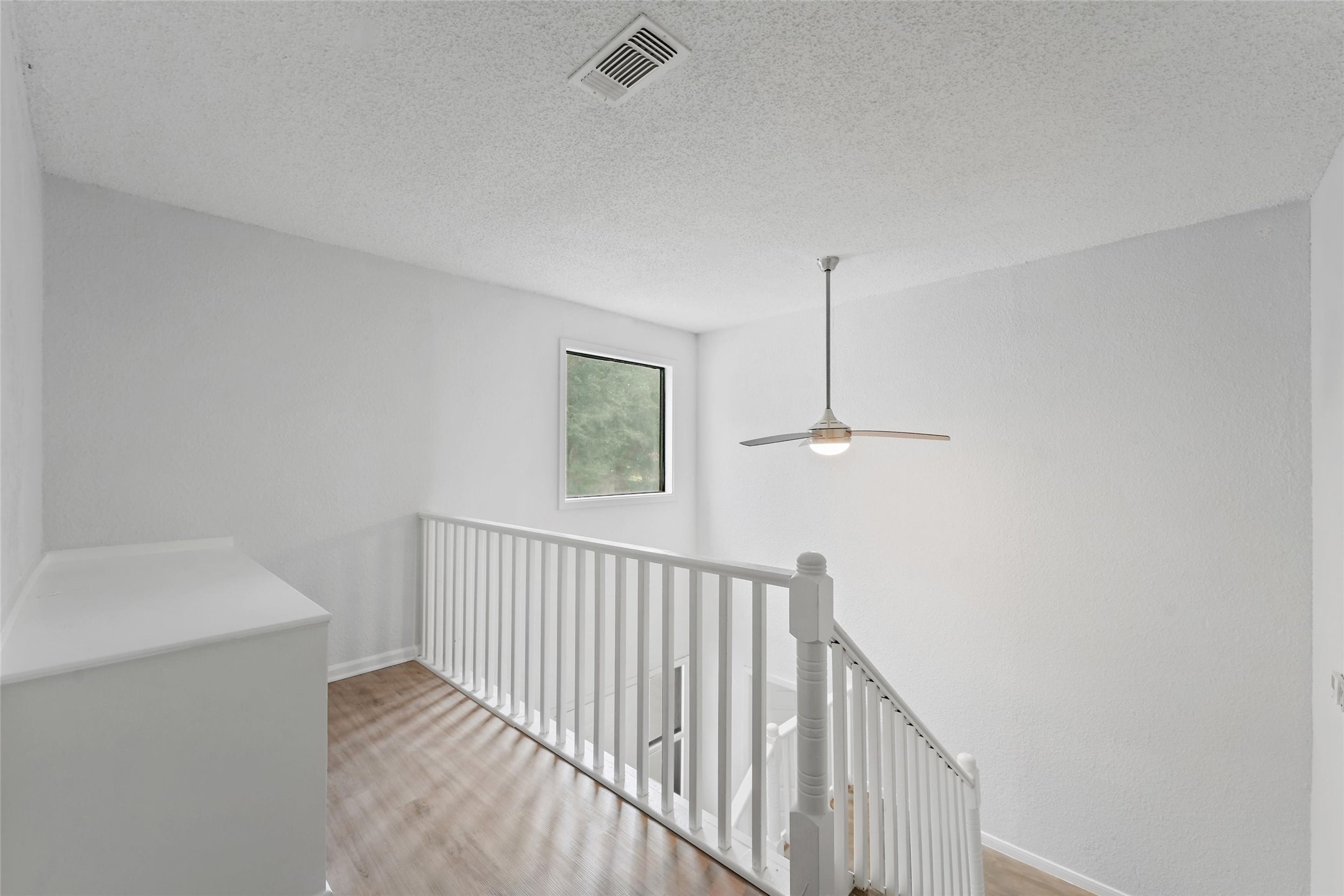 18009 Split Oak Circle New Caney, TX 77357 - Photo 17 of 30 a view of a hallway with windows