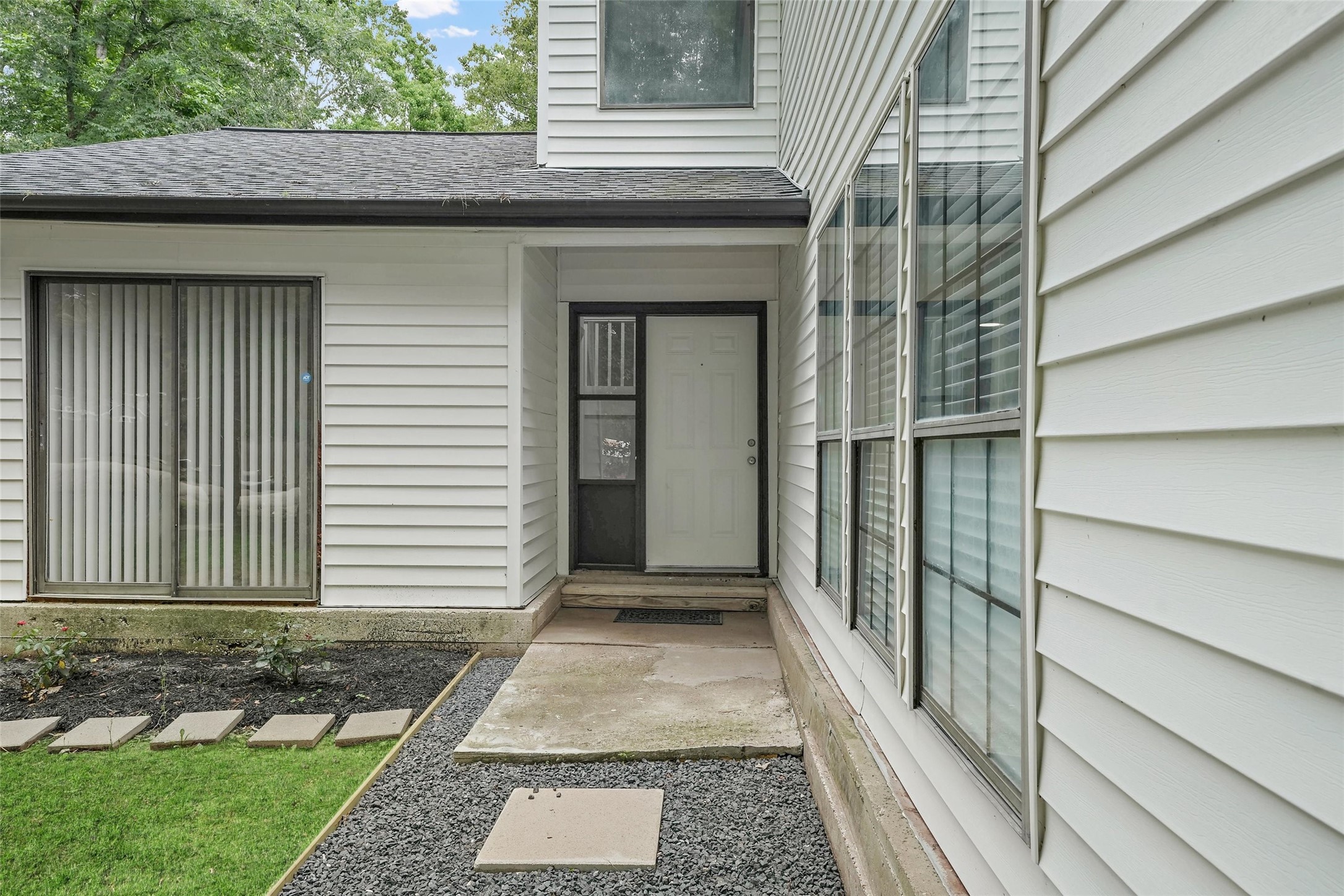 18009 Split Oak Circle New Caney, TX 77357 - Photo 5 of 30 a view of a house with a door and a window