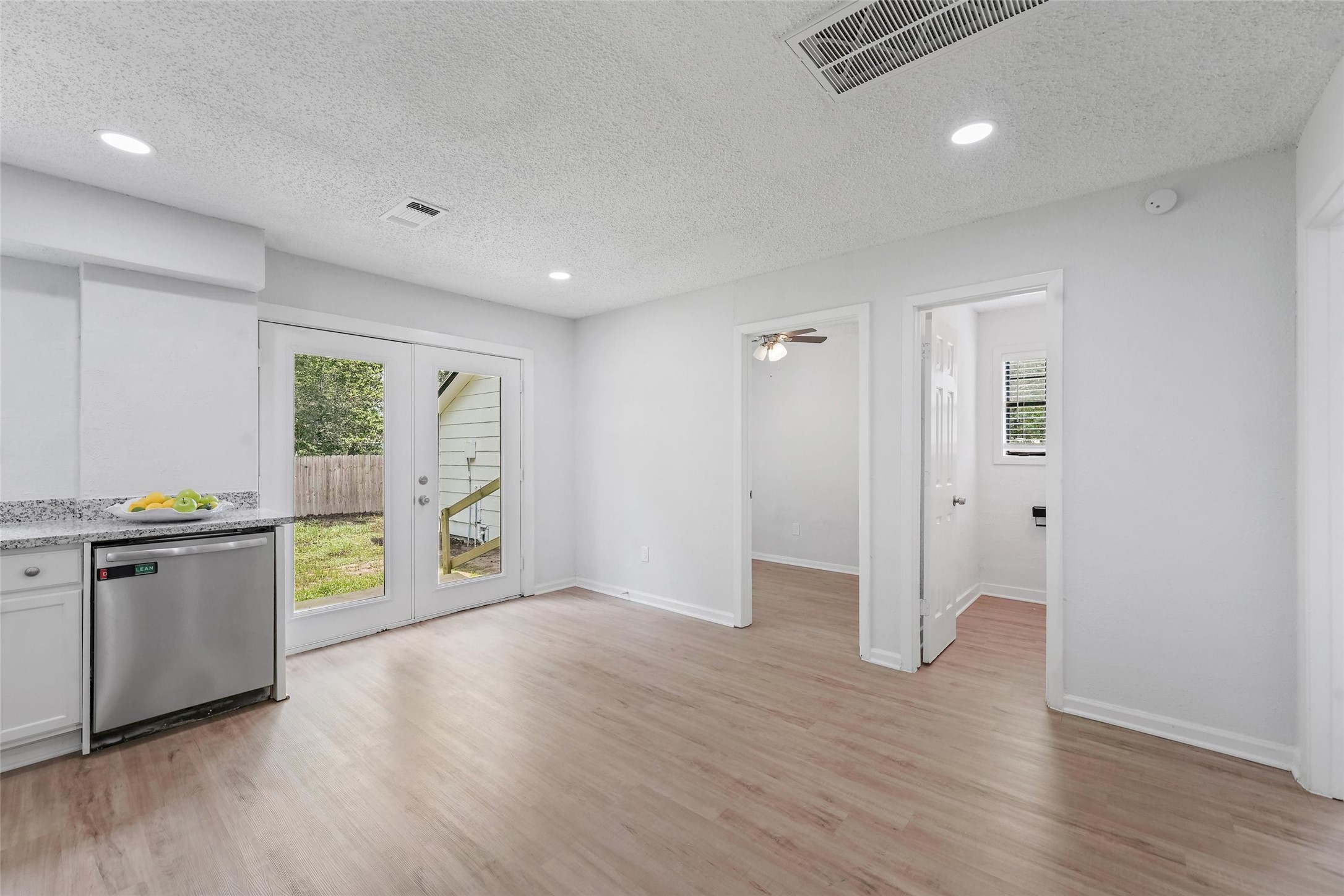 18009 Split Oak Circle New Caney, TX 77357 - Photo 10 of 30 a view of an empty room with window and wooden floor