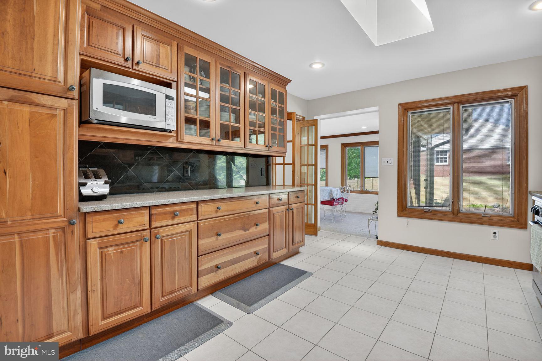 5800 Plainview Road Bethesda, MD 20817 - Photo 7 of 30 a view of an entryway with wooden cabinet and staircase