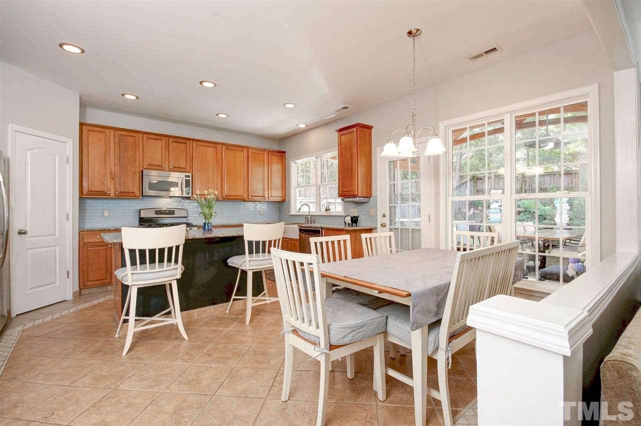 7532 Silver View Lane Raleigh, NC 27613 - Photo 11 of 30 Lots of space to enjoy your morning coffee or take in the view of the amazing backyard.