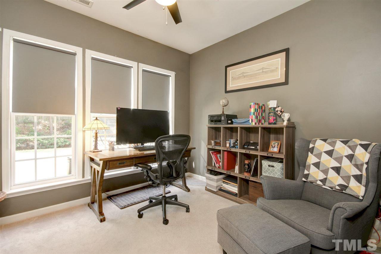 7532 Silver View Lane Raleigh, NC 27613 - Photo 12 of 30 Inviting first floor office with calming paint colors and French doors for privacy.