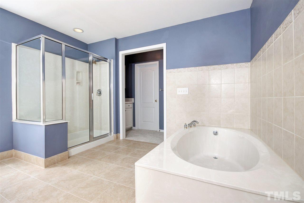 7532 Silver View Lane Raleigh, NC 27613 - Photo 18 of 30 Soak in your garden tub with a nice glass of wine after a hard day of work or play.