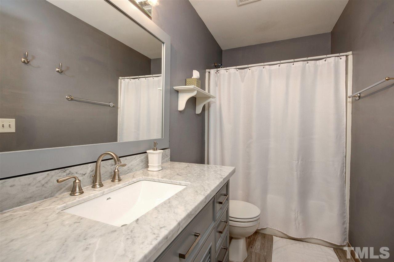7532 Silver View Lane Raleigh, NC 27613 - Photo 21 of 30 Full bathroom on 2nd floor, as well as 1/2 bath on main floor. New vanity, paint, fixtures.