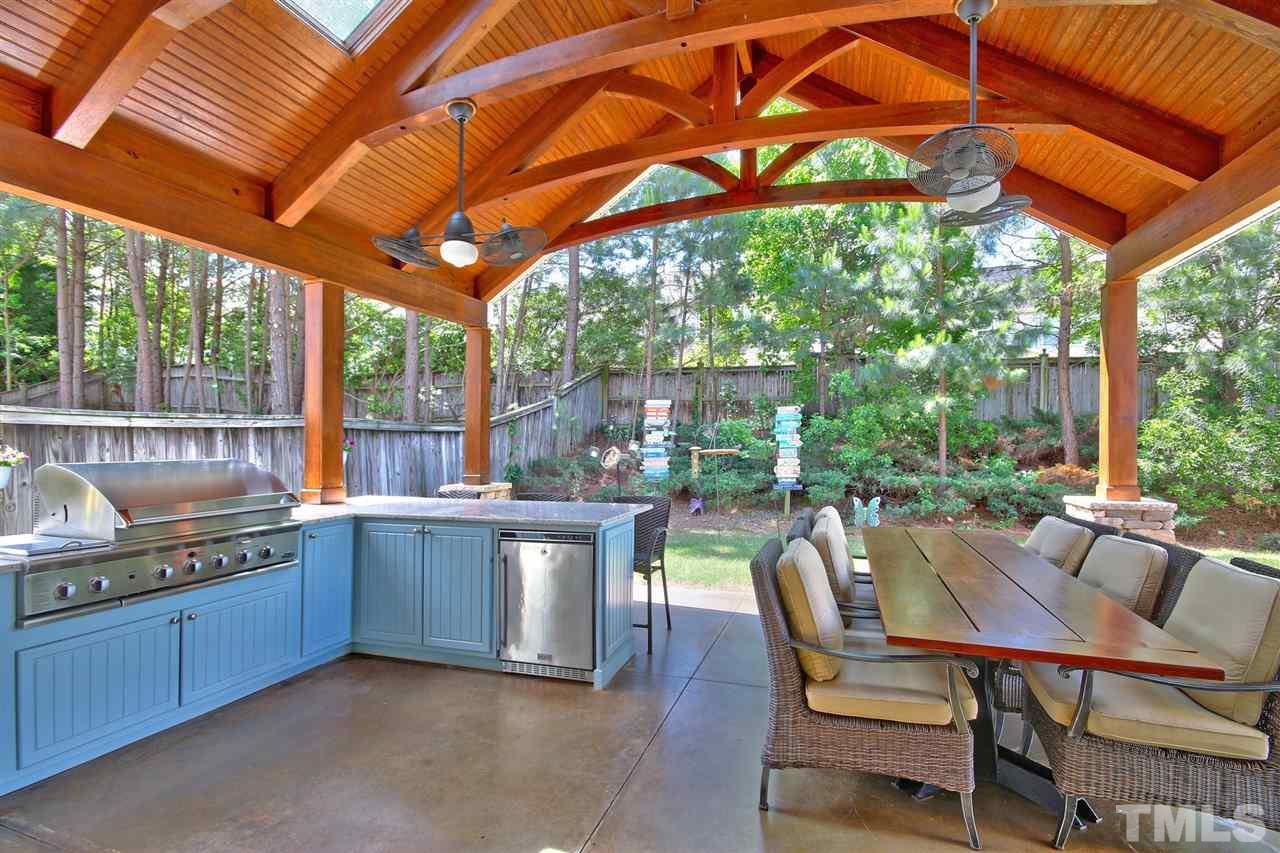 7532 Silver View Lane Raleigh, NC 27613 - Photo 23 of 30 Your own private oasis! This amazing outdoor kitchen is custom built and fantastic! Fitted with a sink, fridge and multi burner grill, there's just no reason to leave your own backyard!