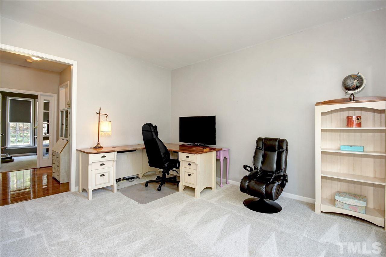 7532 Silver View Lane Raleigh, NC 27613 - Photo 6 of 30 Currently used as an additional office, this would be a great room to cozy up in and catch up on a good book with all the natural lighting through the home.