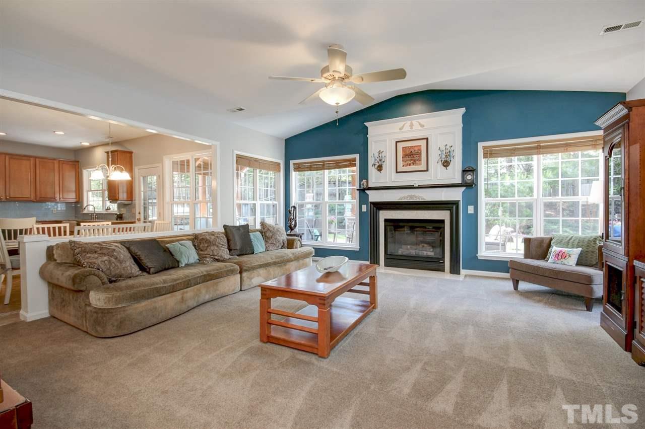 7532 Silver View Lane Raleigh, NC 27613 - Photo 7 of 30 Huge family room with gas fireplace. Ceiling fan and ample room for entertaining friends and family. Open to the kitchen and breakfast room so invite your new neighbors over and host a house warming party!