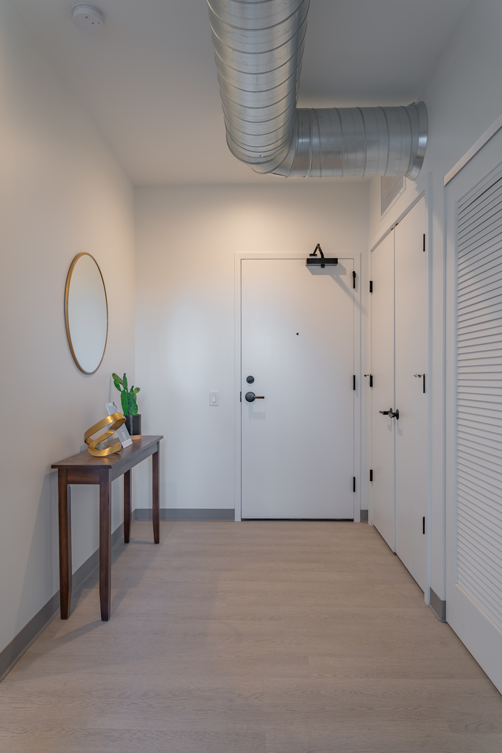 Undisclosed Address Chicago, IL 60642 - Photo 2 of 15 a view of a livingroom with furniture