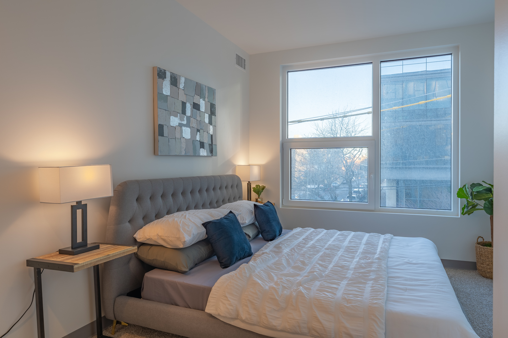 Undisclosed Address Chicago, IL 60642 - Photo 7 of 15 a bed sitting in a bedroom next to a window