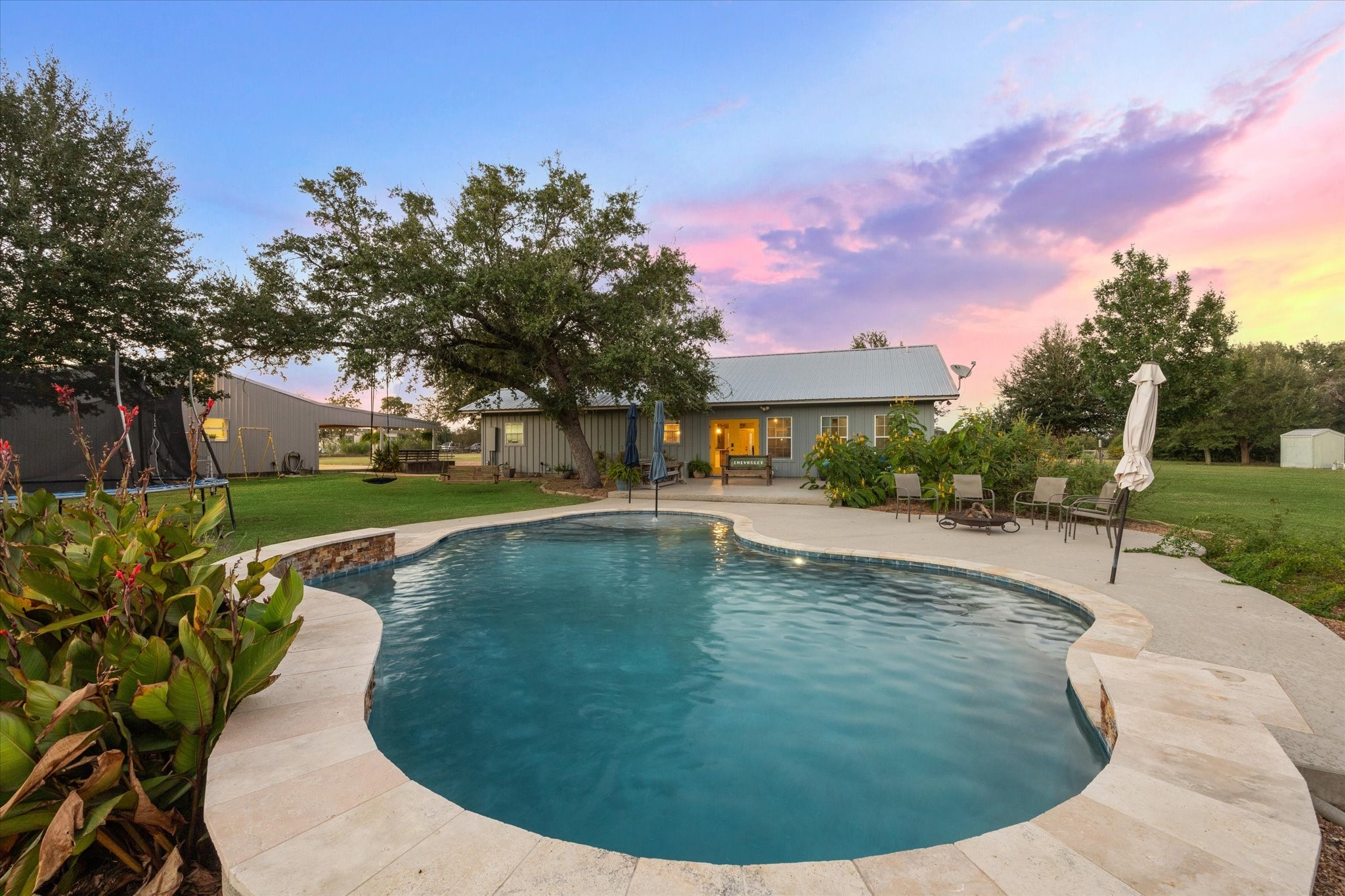 2510 Round Top Road Round Top, TX 78954 - Photo 19 of 20 a view of a swimming pool with a yard