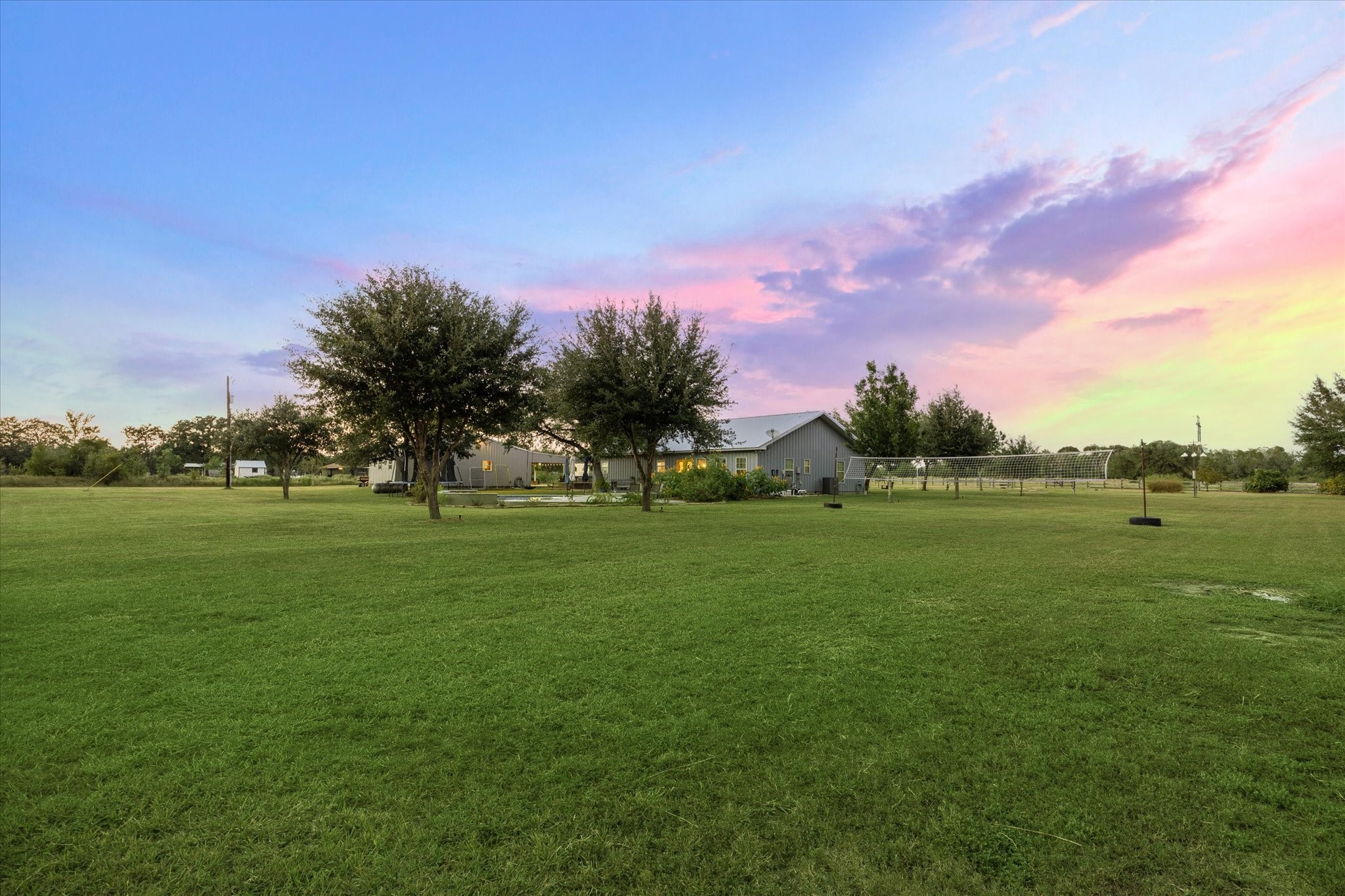 2510 Round Top Road Round Top, TX 78954 - Photo 20 of 20 a view of a green field with trees in the background