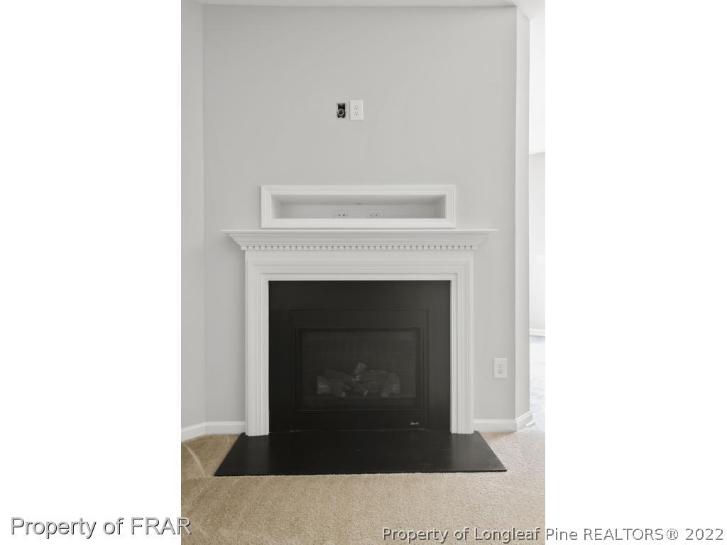 162 Watchmen Lane Cameron, NC 28326 - Photo 8 of 23 a living room with a fireplace