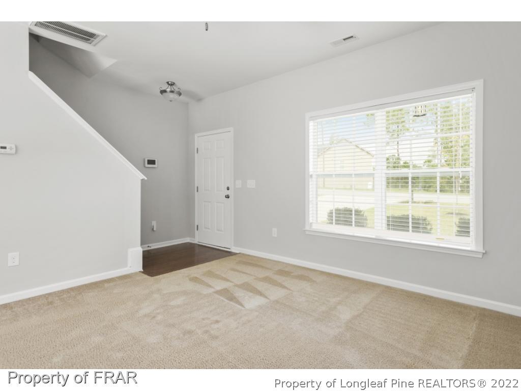 162 Watchmen Lane Cameron, NC 28326 - Photo 9 of 23 a view of an empty room with a window