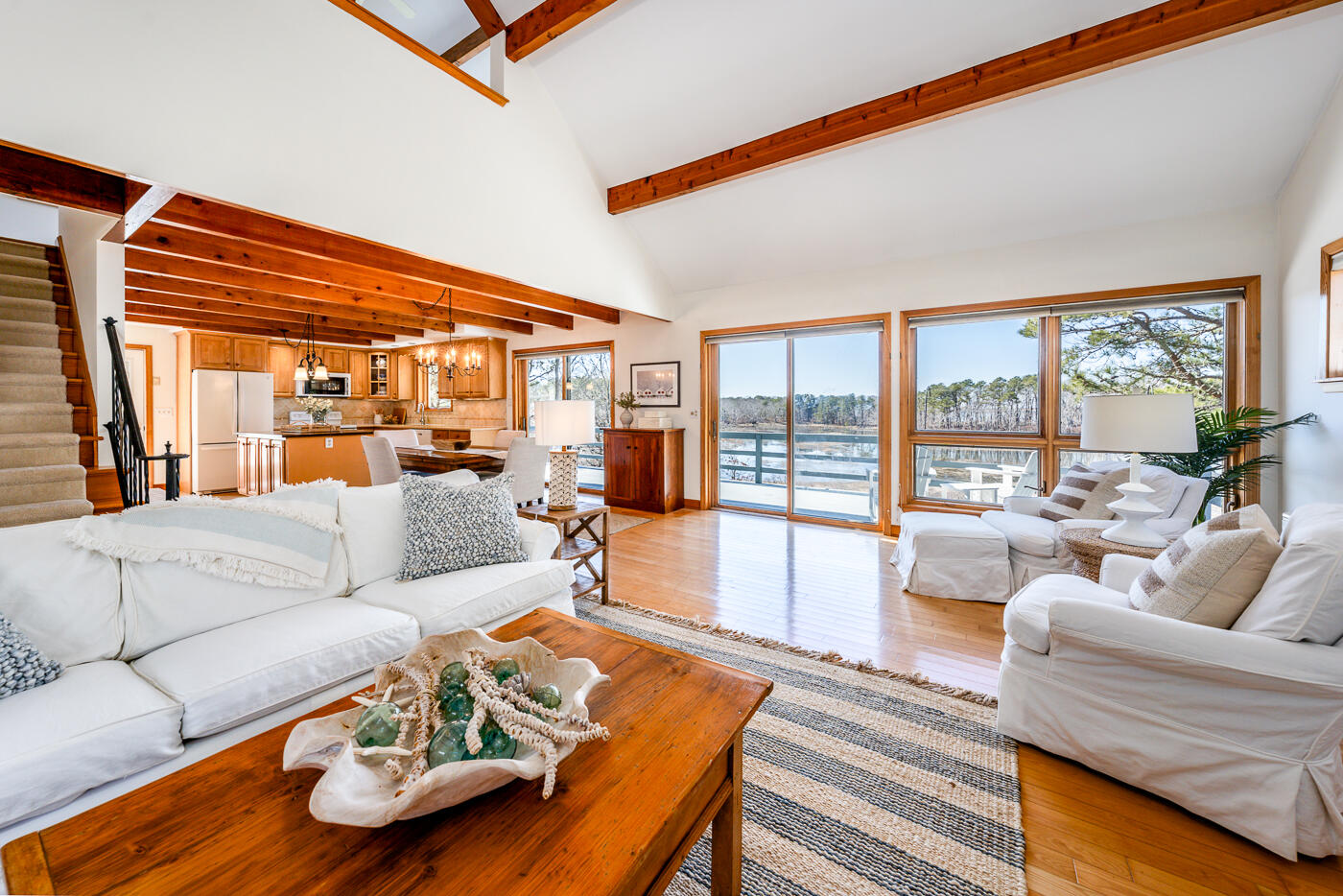 210 Lieutenant Island Road Wellfleet, MA 02667 - Photo 11 of 47 a living room with furniture and a large window