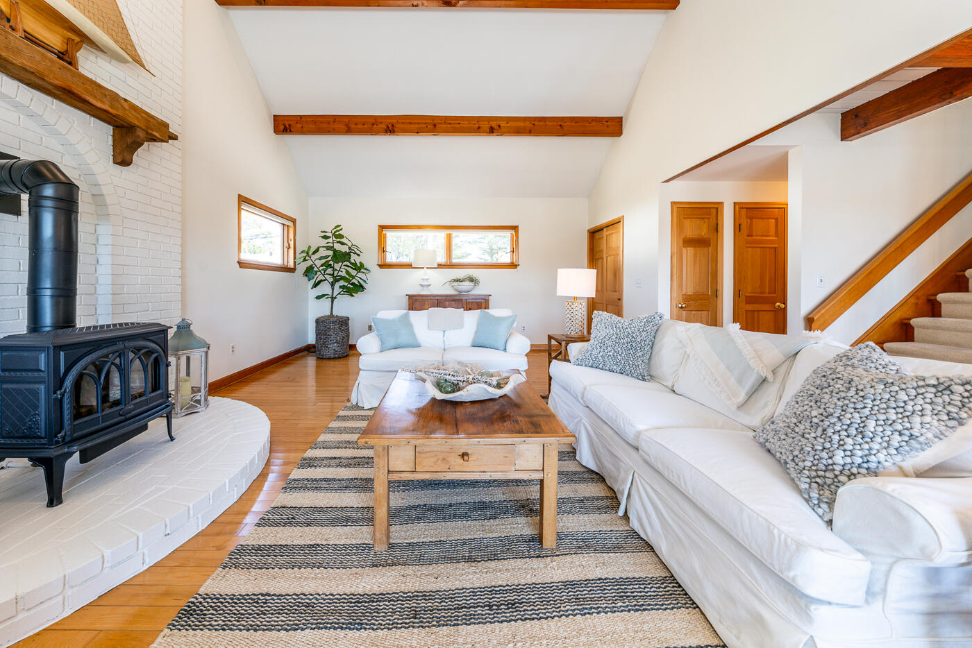 210 Lieutenant Island Road Wellfleet, MA 02667 - Photo 12 of 47 a living room with furniture a rug and a table