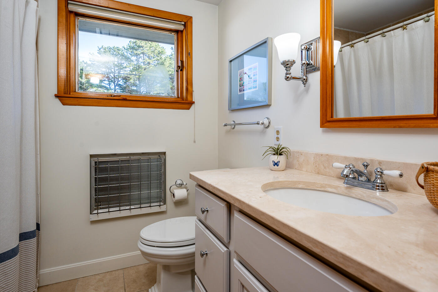 210 Lieutenant Island Road Wellfleet, MA 02667 - Photo 17 of 47 a bathroom with a granite countertop toilet sink and mirror