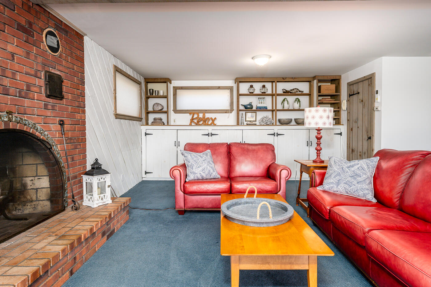 210 Lieutenant Island Road Wellfleet, MA 02667 - Photo 29 of 47 a living room with furniture a rug and a fireplace