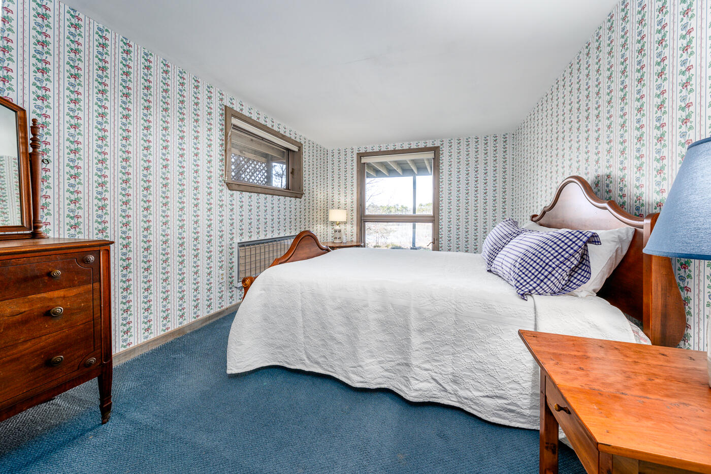 210 Lieutenant Island Road Wellfleet, MA 02667 - Photo 33 of 47 a bedroom with a bed and wooden floor