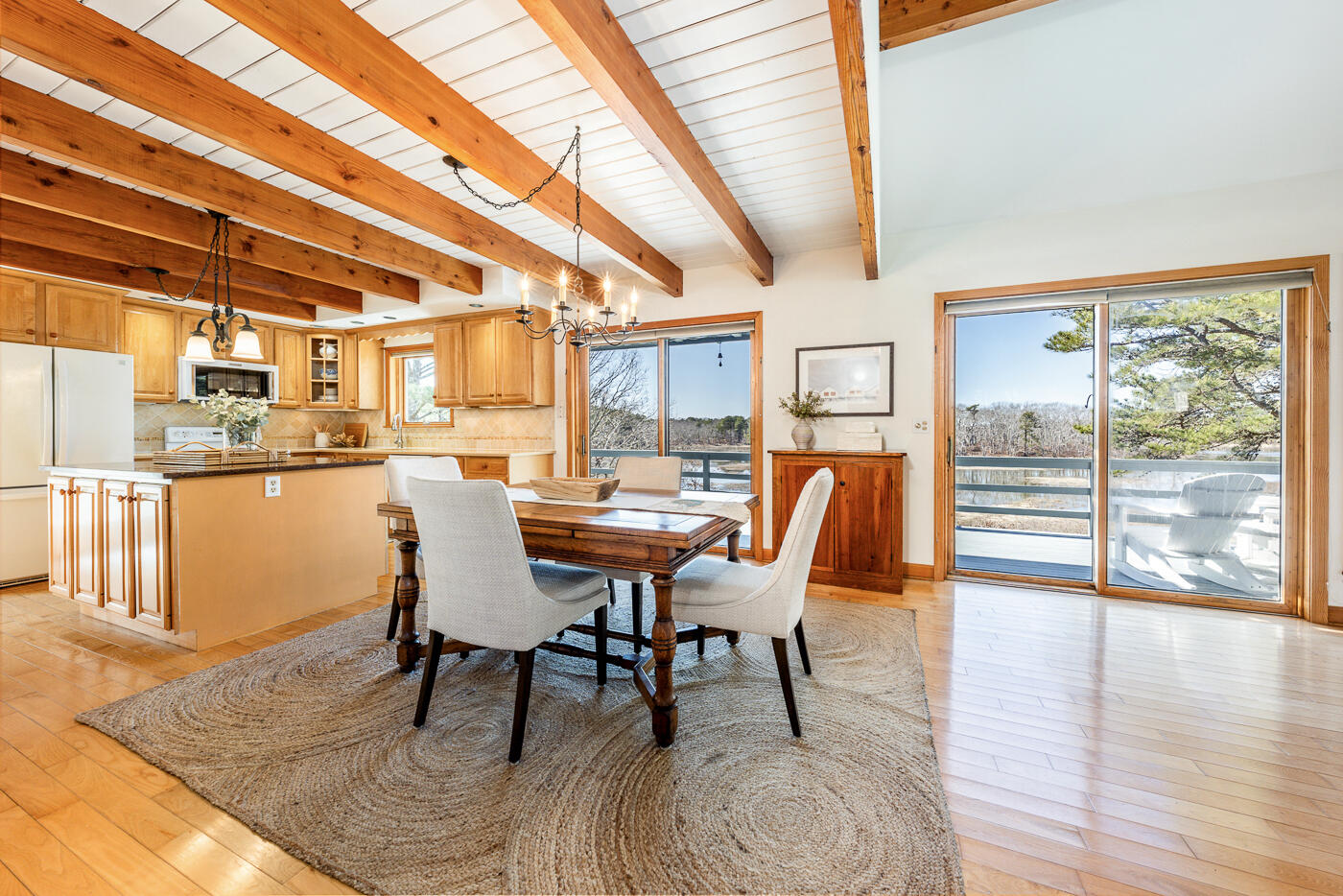 210 Lieutenant Island Road Wellfleet, MA 02667 - Photo 7 of 47 a dining room with furniture and wooden floor