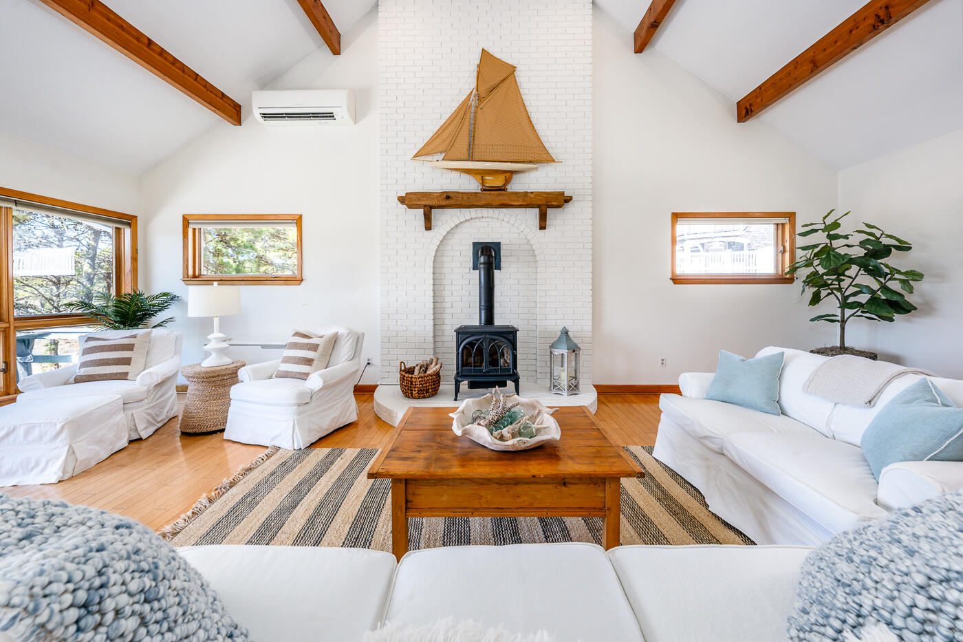 210 Lieutenant Island Road Wellfleet, MA 02667 - Photo 10 of 47 a living room with furniture or couch and a lamp