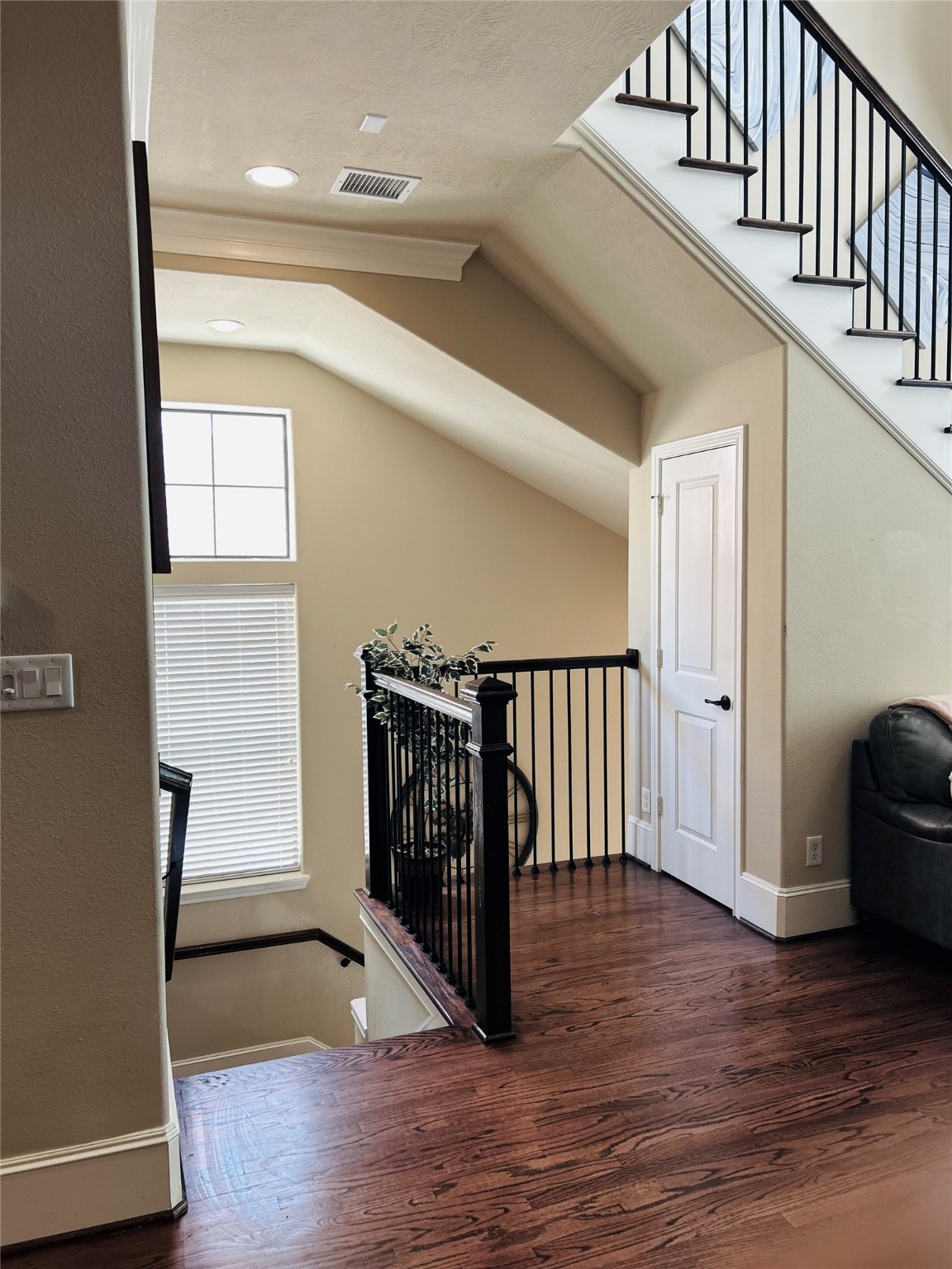 1049 West 22nd Street, Unit H Houston, TX 77008 - Photo 4 of 43 a view of a hallway with wooden floor and stairs
