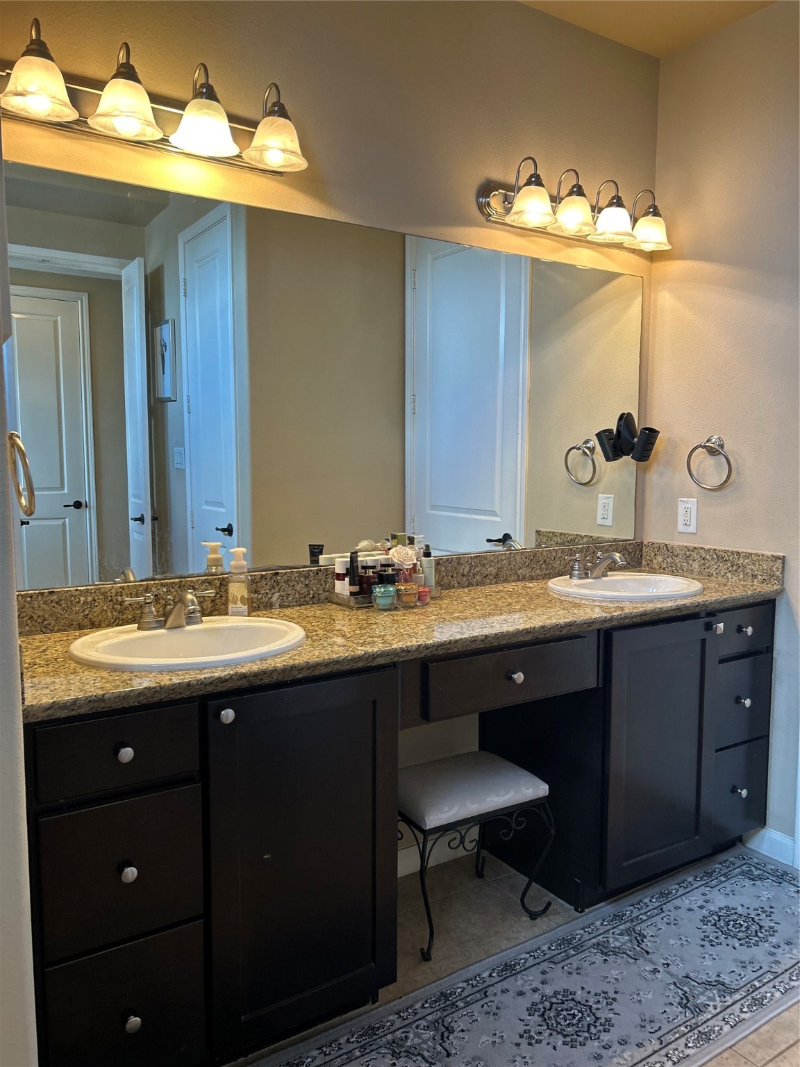 1049 West 22nd Street, Unit H Houston, TX 77008 - Photo 10 of 43 a bathroom with a granite countertop sink and a mirror