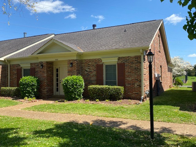 1302 General George Patton Road Nashville, TN 37221 - Photo 1 of 14 a front view of a house with garden