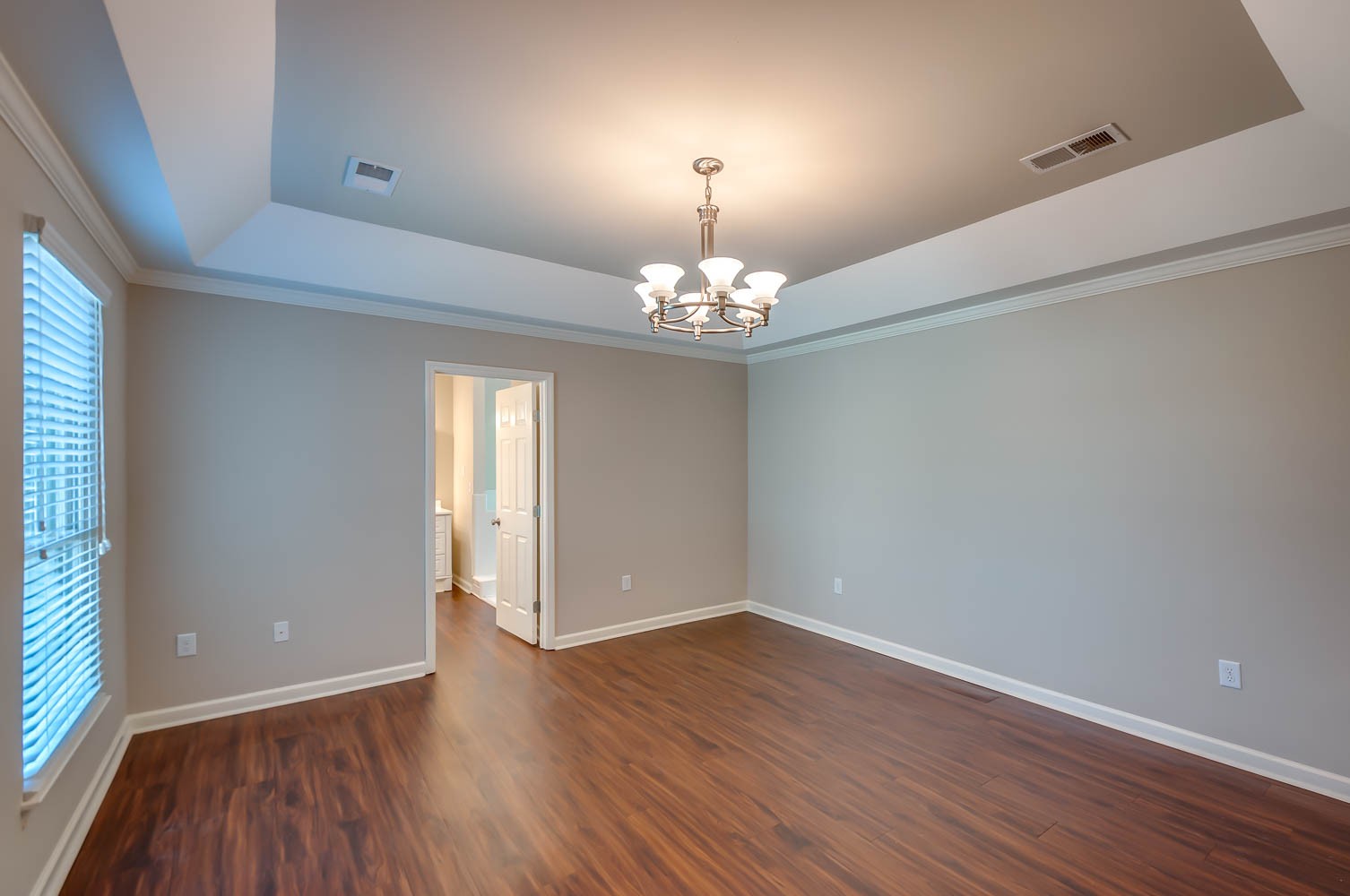 1302 General George Patton Road Nashville, TN 37221 - Photo 8 of 14 a view of a room with wooden floor and chandelier
