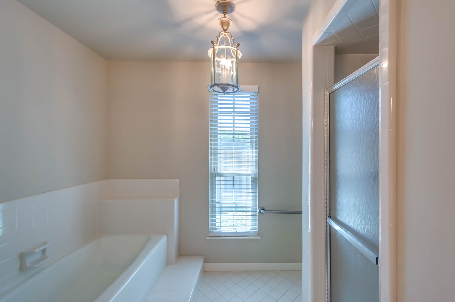 1302 General George Patton Road Nashville, TN 37221 - Photo 10 of 14 a bathroom with a bathtub and shower