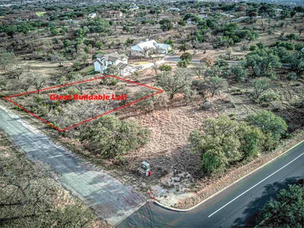 a view of lot of trees and yard