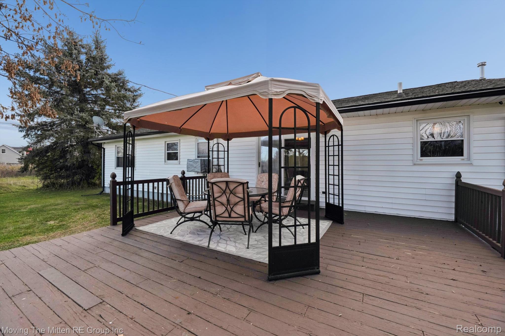 12000 Plank Road Milan, MI 48160 - Photo 31 of 49 Deck featuring a gazebo, outdoor dining area, and a yard