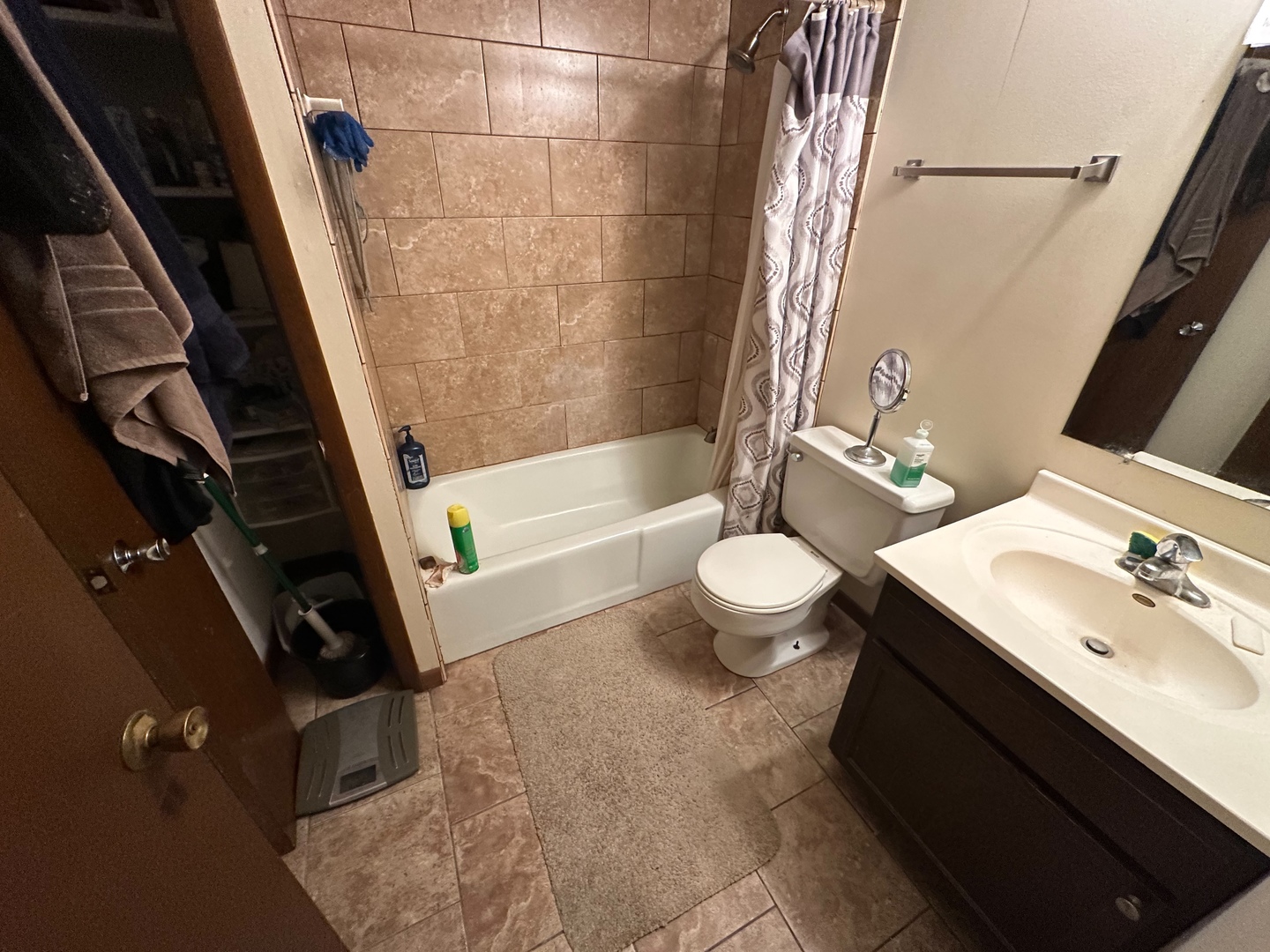 2121 176th Place Lansing, IL 60438 - Photo 12 of 26 a bathroom with a sink a toilet and shower