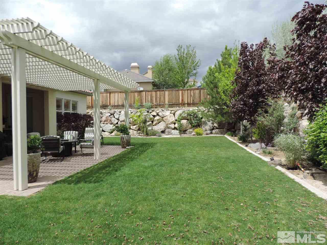 8588 Timaru Trail Reno, NV 89523 - Photo 2 of 25 a view of a chair and table in the garden