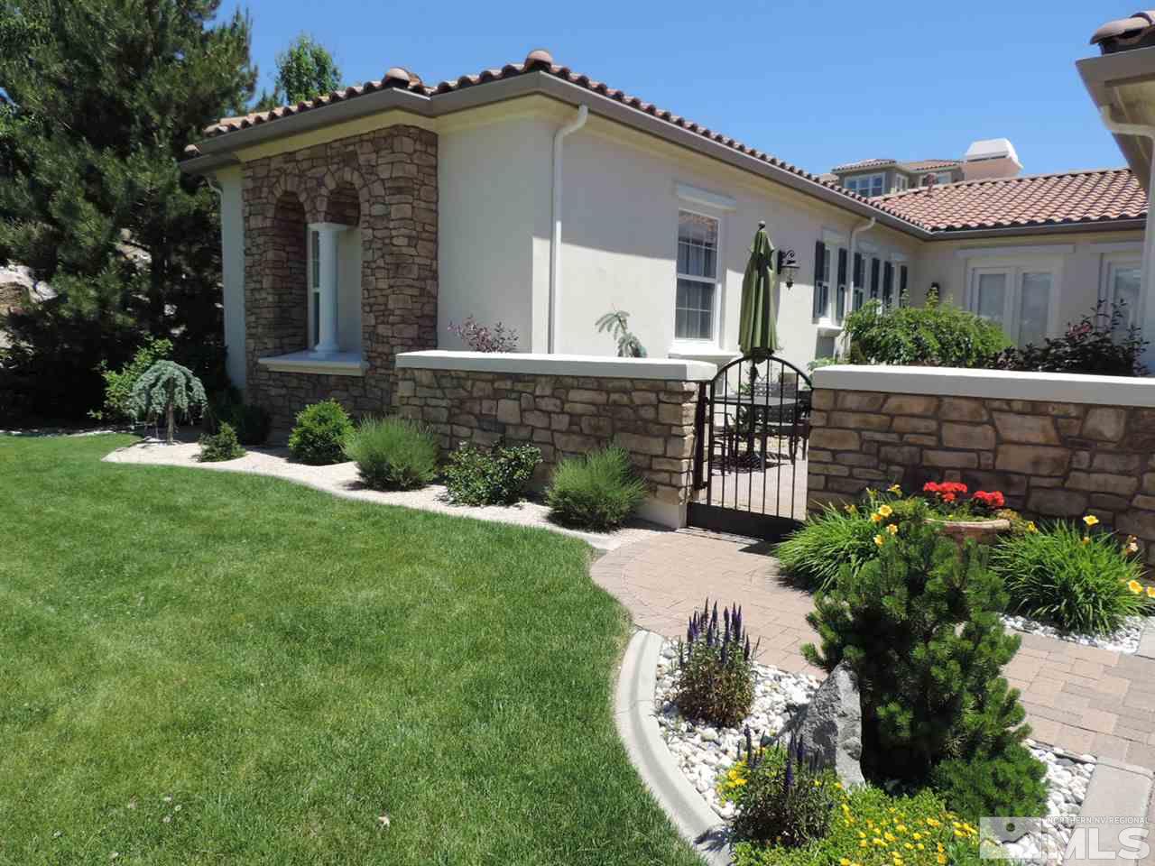 8588 Timaru Trail Reno, NV 89523 - Photo 23 of 25 a front view of a house with a yard