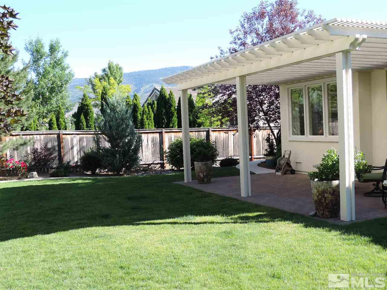 8588 Timaru Trail Reno, NV 89523 - Photo 3 of 25 a view of a house with backyard and sitting area