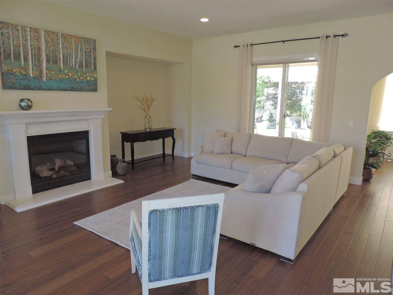 8588 Timaru Trail Reno, NV 89523 - Photo 4 of 25 a living room with furniture and a fireplace