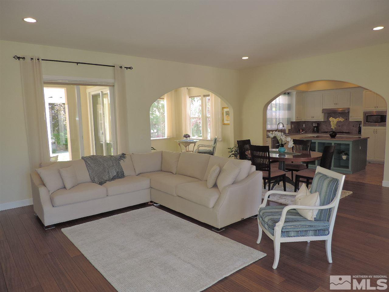 8588 Timaru Trail Reno, NV 89523 - Photo 5 of 25 a living room with furniture a large window and a dining table