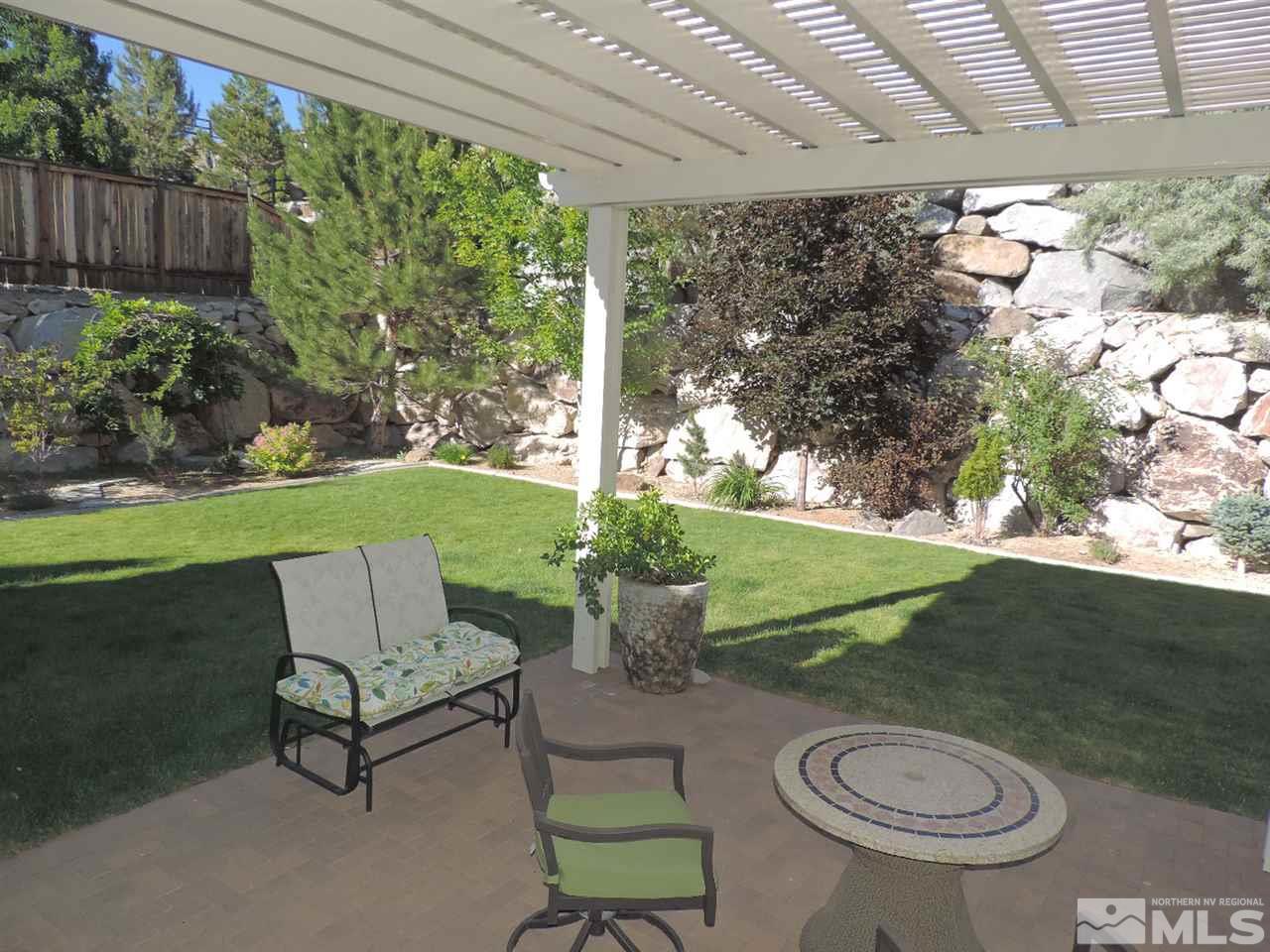 8588 Timaru Trail Reno, NV 89523 - Photo 10 of 25 a view of a two chairs in a yard