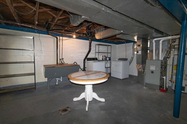 935 Howden Street Pittsburgh, PA 15202 - Photo 16 of 16 a room with furniture and a chandelier