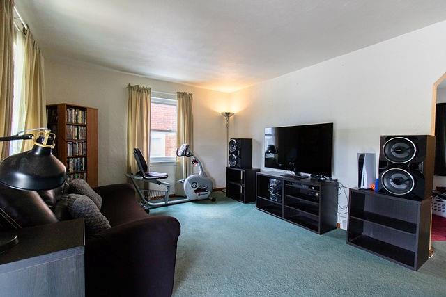 935 Howden Street Pittsburgh, PA 15202 - Photo 2 of 16 a living room with furniture and a flat screen tv