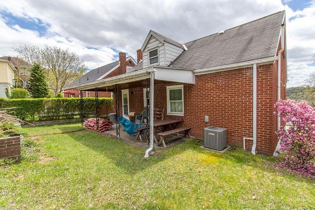 935 Howden Street Pittsburgh, PA 15202 - Photo 5 of 16 a view of a chair and table in backyard of the house