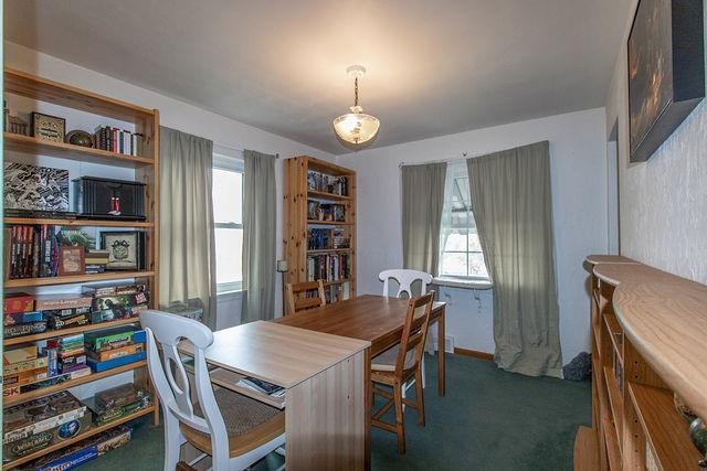 935 Howden Street Pittsburgh, PA 15202 - Photo 7 of 16 a view of a dining room with furniture and a book shelf