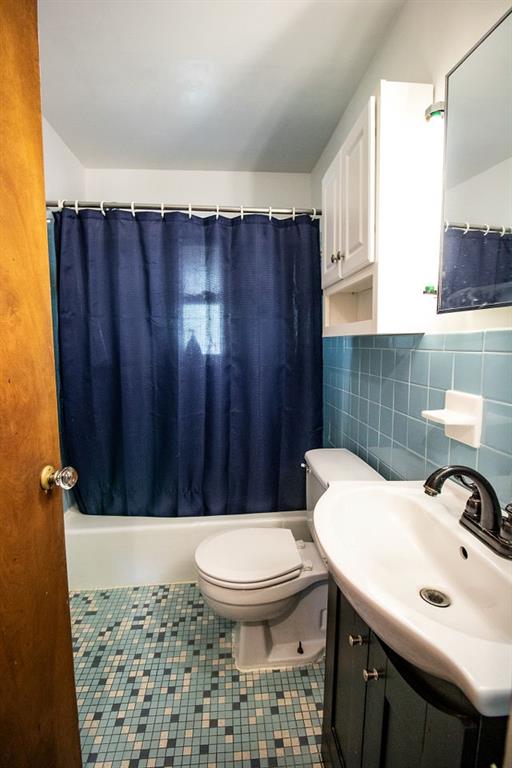 935 Howden Street Pittsburgh, PA 15202 - Photo 9 of 16 a bathroom with a sink a toilet and shower