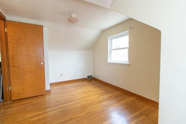 935 Howden Street Pittsburgh, PA 15202 - Photo 10 of 16 an empty room with wooden floor and windows