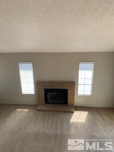 1775 Amarak Way Reno, NV 89523 - Photo 12 of 17 an empty room with windows & fireplace