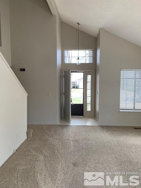 1775 Amarak Way Reno, NV 89523 - Photo 13 of 17 an empty room with chandelier fan and windows