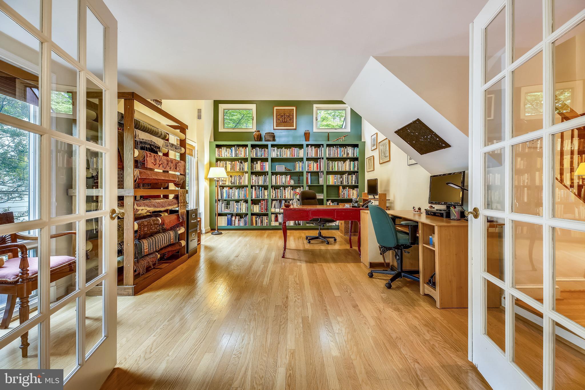 6517 Wiscasset Road Bethesda, MD 20816 - Photo 17 of 51 Library with High Ceilings and Display Shelving