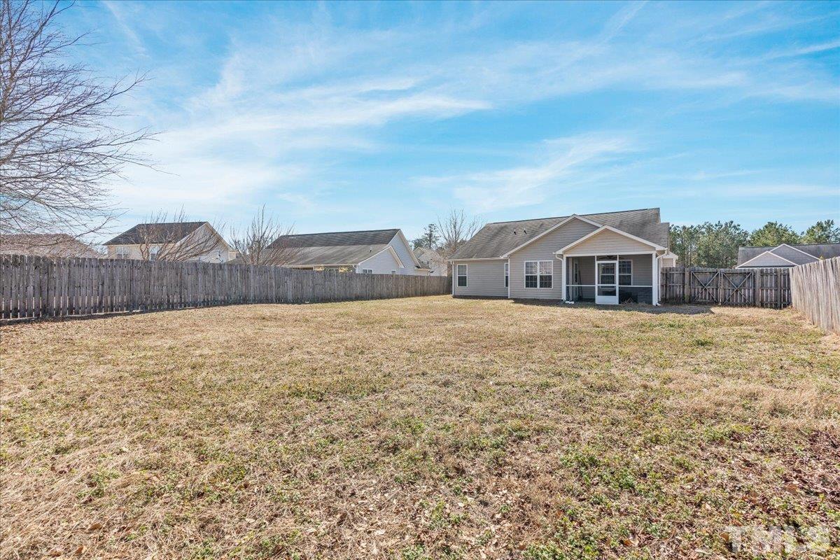 549 Cape Fear Road Raeford, NC 28376 - Photo 25 of 27 a front view of house with yard and mountain view in back
