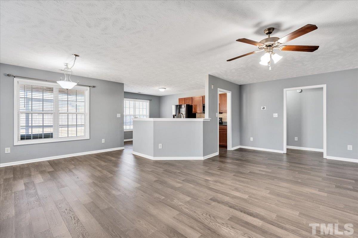 549 Cape Fear Road Raeford, NC 28376 - Photo 9 of 27 a view of an empty room with window and wooden floor