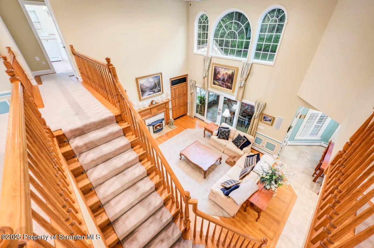 922 Old Logger Road Moscow, PA 18444 - Photo 11 of 93 view of living room with furniture and floor to ceiling windows